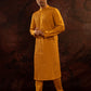Honey yellow Pintuck kurta with stitchline detailing in sleeves and back. Comes with churidar.