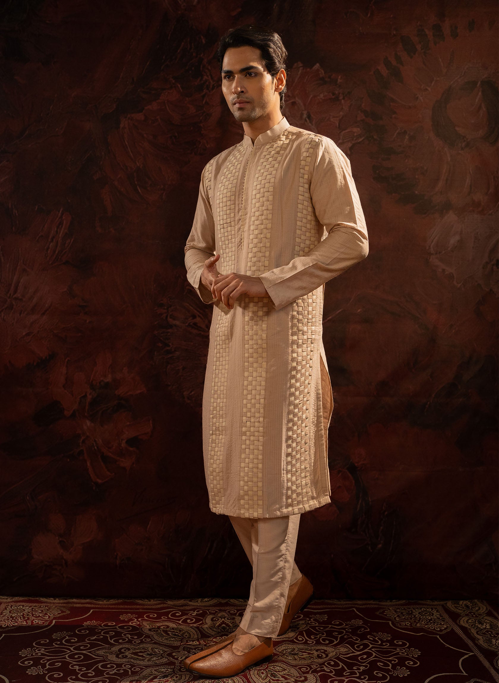 Pearl Pintuck Kurta with beige fabric mesh. Comes with straight pants with two side pockets and zip opening.
