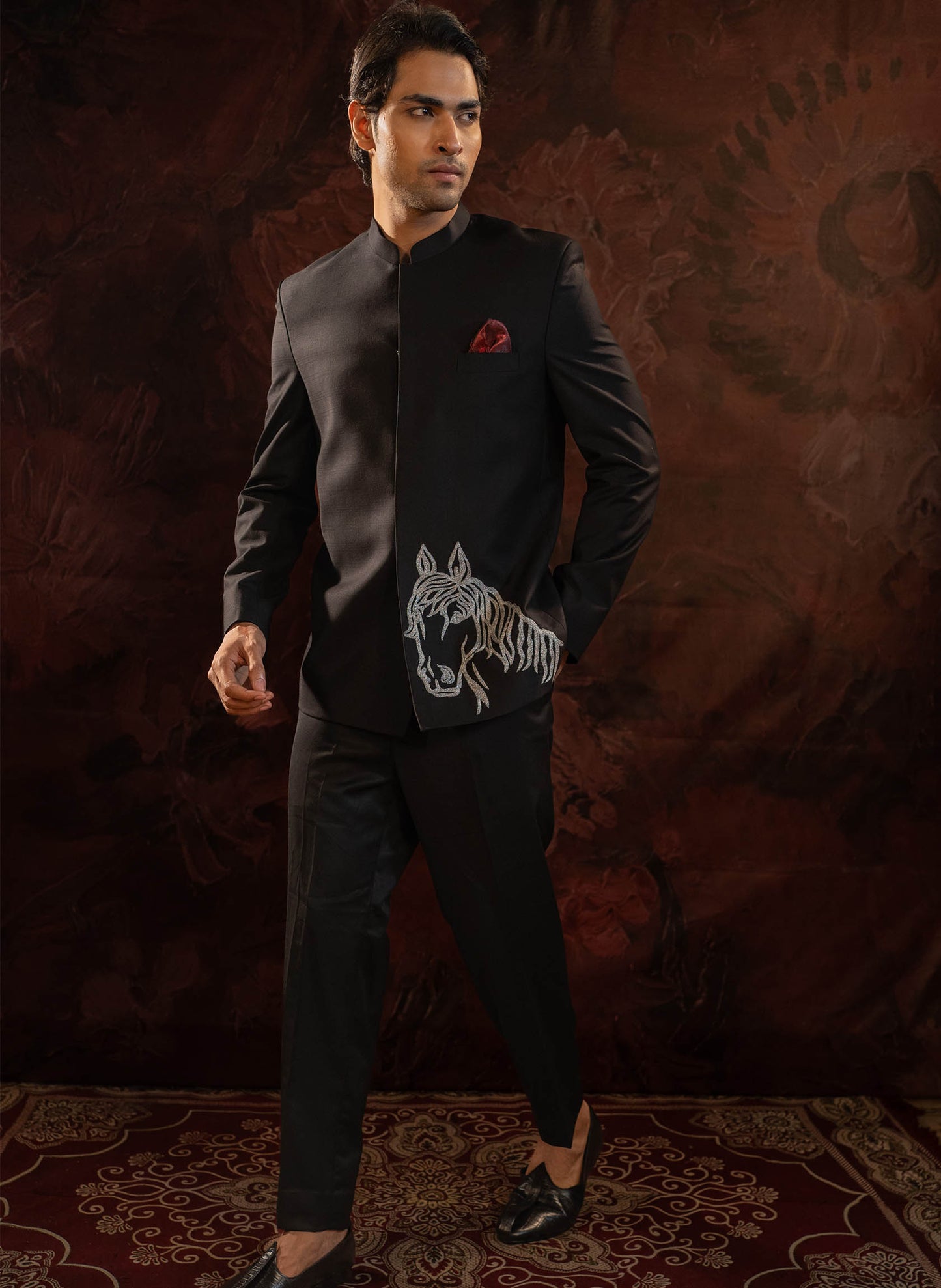Classic Black Bandhgala with quirky horse motif in silver zari embroidery. Comes with Narrow fit trousers.
