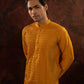 Honey yellow Pintuck kurta with stitchline detailing in sleeves and back. Comes with churidar.