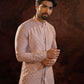 Lavender layered kurta set with front opening and embroidered floral motifs. Embroidery detailing on cuffs and back. Comes with straight pants with two side pockets and zip opening.